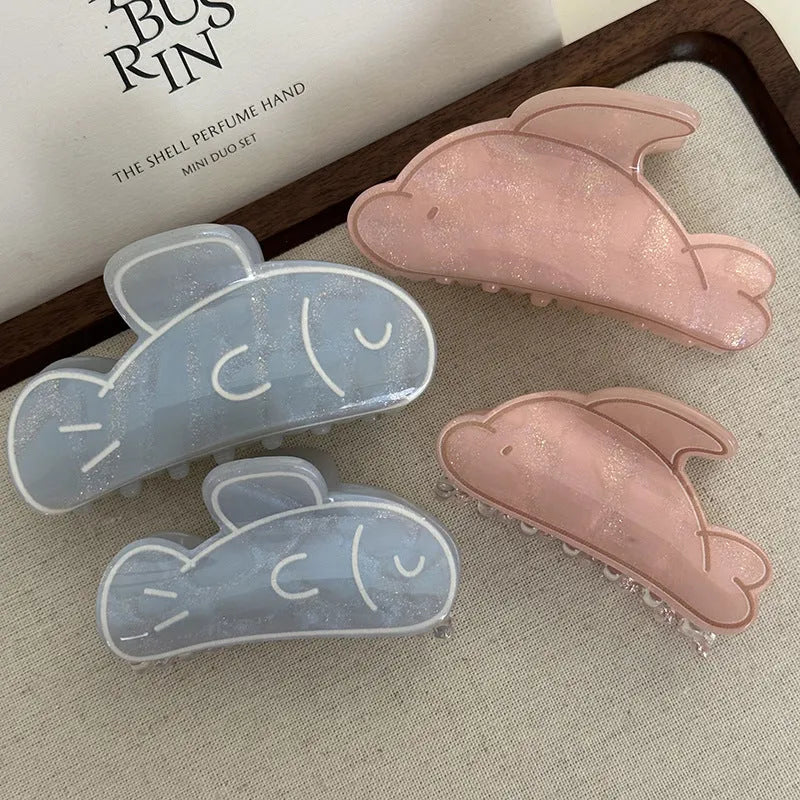 Dolphin grabber clip hair accessory for women in blue fish and pink dolphin colours, barrette style