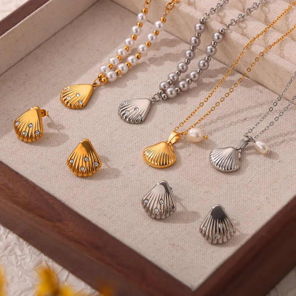 French vintage shell pendant necklace with titanium steel chain and freshwater pearl bead on gold background