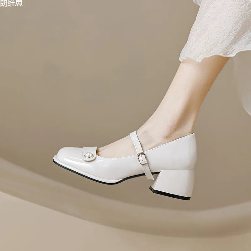 French-style women's chunky heel pumps with buckle fastening, square toe, in patent leather with rubber sole.