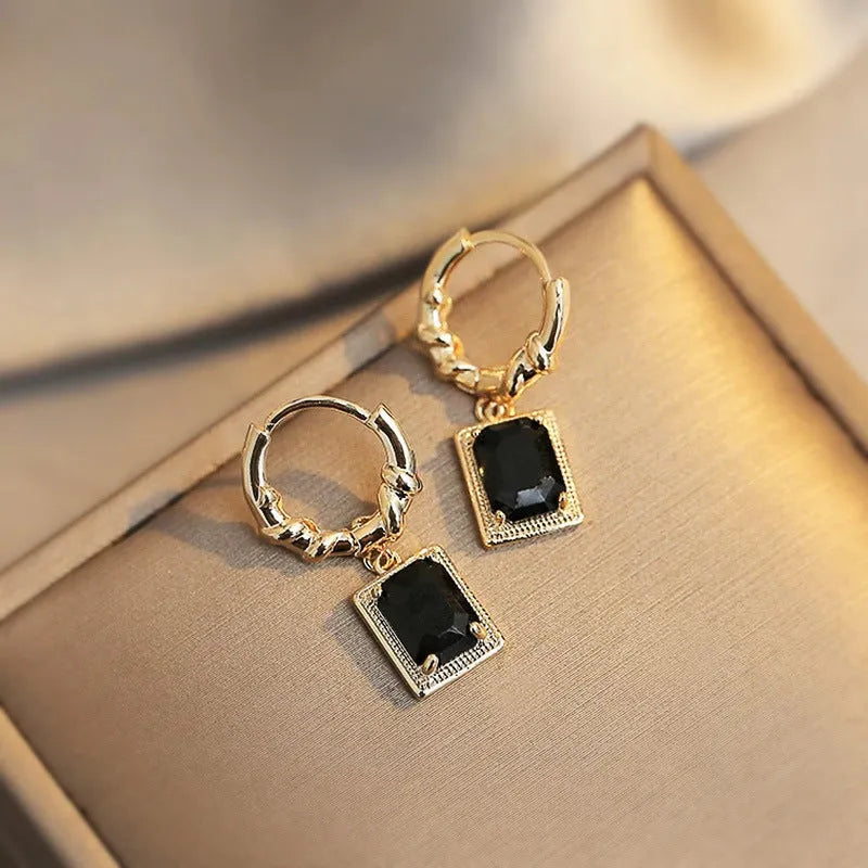 Geometric copper earrings with black zircon accents in quadrilateral design