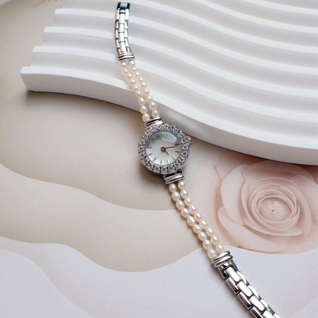 Women's light gold bracelet watch with freshwater pearls, 18mm round dial, stainless steel strap