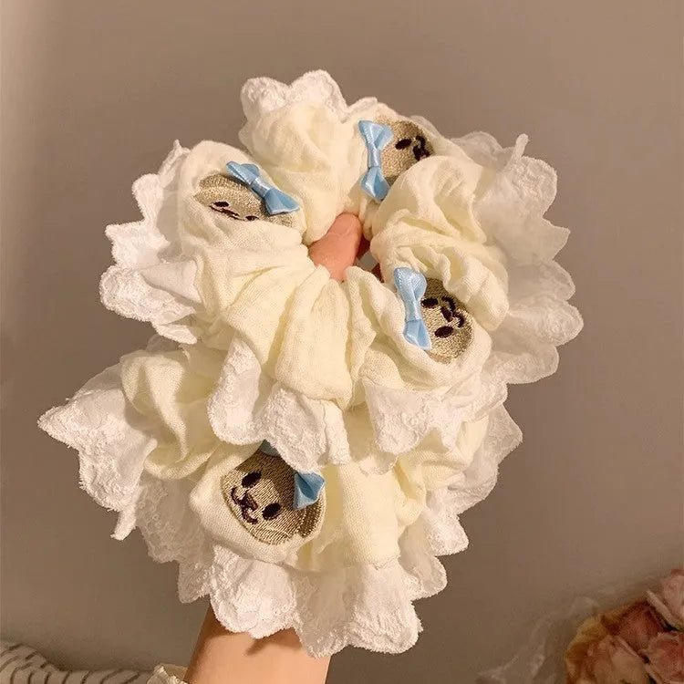 Blue cloth hair ring with bear motif and bowknot design on elastic band