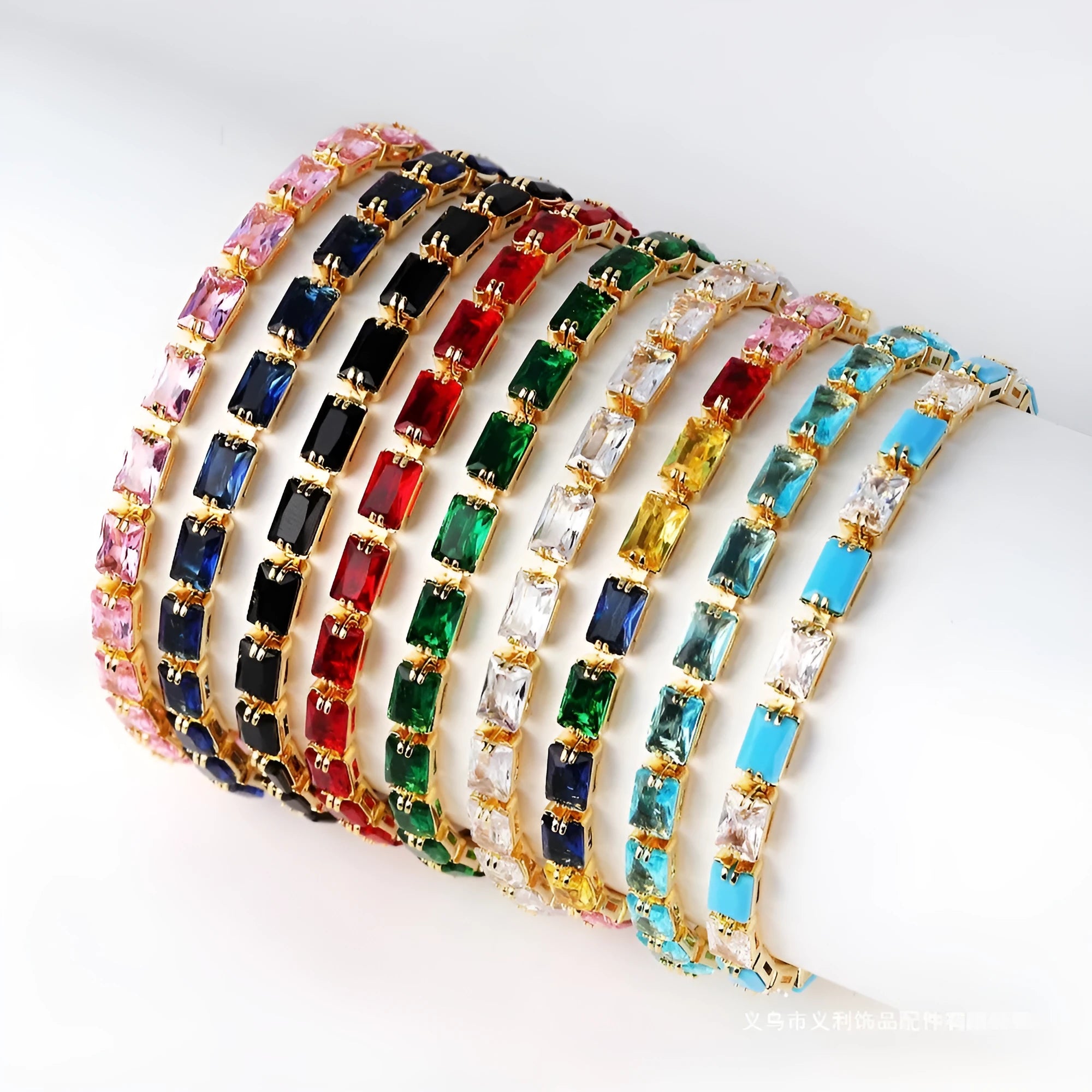 Electroplated zircon bracelet for women with gold tone finish and blue zircon stones