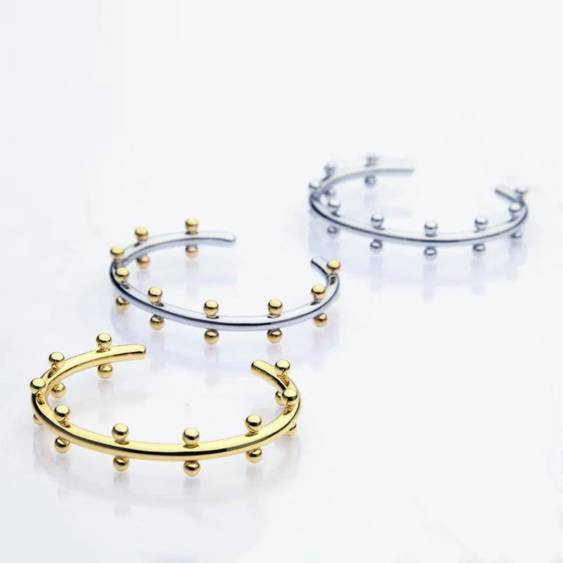 Stainless steel C-shaped bracelet with rivet texture bean beads and alloy clasp in gold colour option