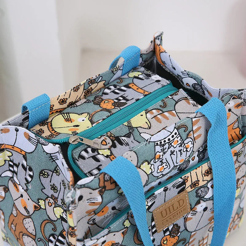 Women's portable printed canvas handbag with floral or animal motifs, aluminium hardware, and horizontal square shape