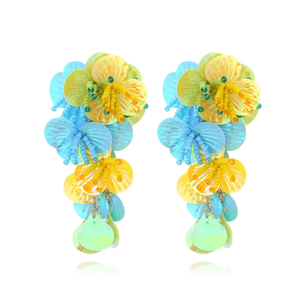 Handmade string bead flower earrings with exaggerated floral designs in rose and purple colours, measuring 5-7cm