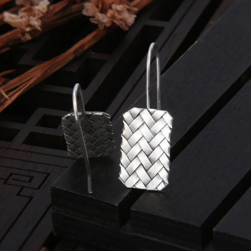 Silver geometric earrings with woven diamond plaid pattern, measuring 17.5mm by 11mm