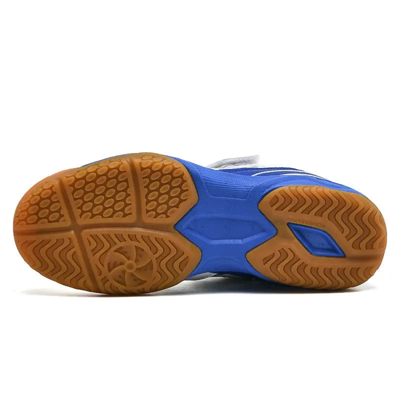 Breathable and non-slip badminton shoes in white and blue with ribbed outsole, low-top design, and hand-painted details.