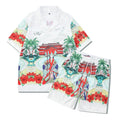 Plaid patterned short-sleeve shirt and matching trousers laid flat, a blue and white beachwear set.