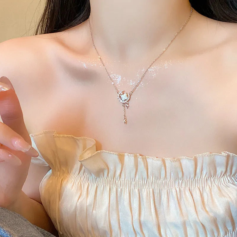 Women's star and moon pendant necklace with zirconium details on adjustable copper clavicle chain