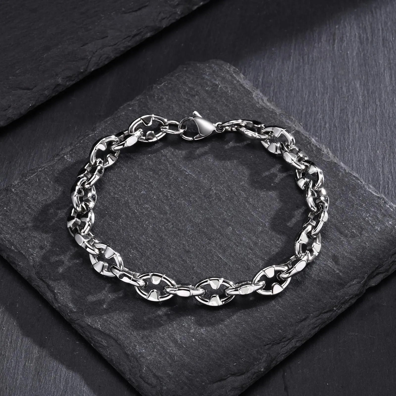 Stainless steel geometric chain bracelet with 6mm thick links and adjustable clasp on wrist