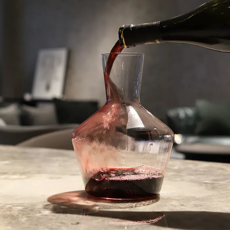 Clear glass wine decanter with removable interior divider shown on a table