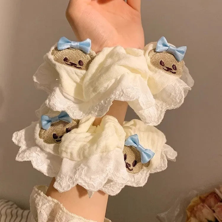 Blue cloth hair ring with bear motif and bowknot design on elastic band