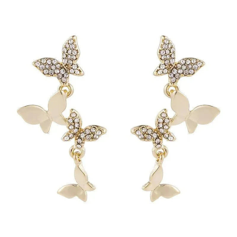 Women's gold-coloured copper butterfly earrings with four butterfly drop design