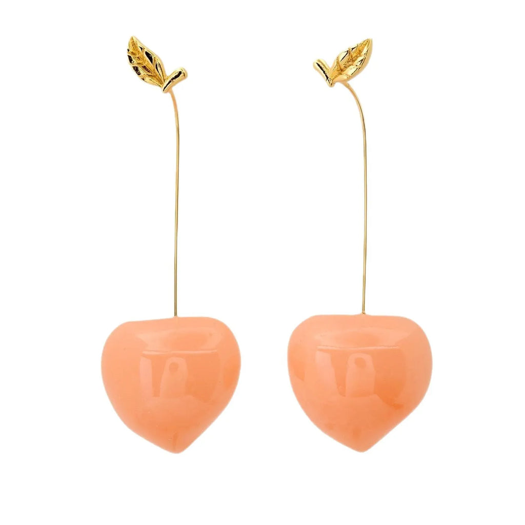 Gold plated copper earrings shaped like carrots, lemons, blueberries, olives, oranges, peaches, and chillies.