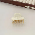 Set of retro-style alloy acrylic women's hair barrettes with metal grip in beige, white, ink and leopard print colours.
