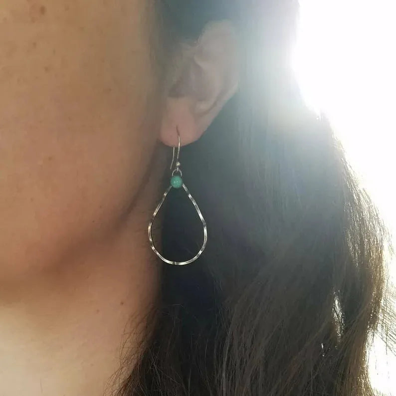Geometric circle earrings with antique silver finish and turquoise accents in Bohemian style