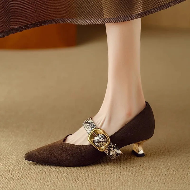 Women's black stiletto high heels with French pointed toe and decorative buckle fastening