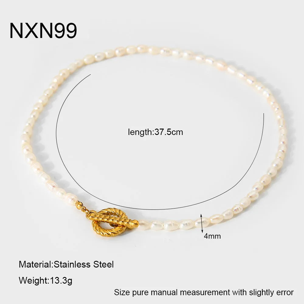 Freshwater pearl and stainless steel geometric pendant necklace and matching bracelet set for women.