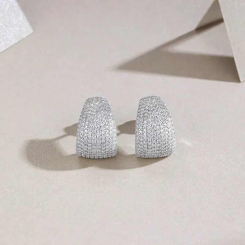 Geometric silver stud earrings with moissanite stones showing front and back views