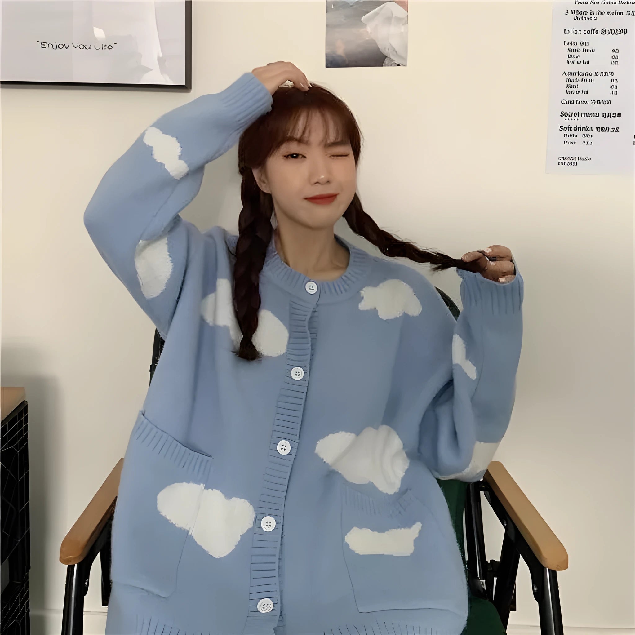 Blue loose-fit women's spandex cardigan sweater with a white cloud pattern.