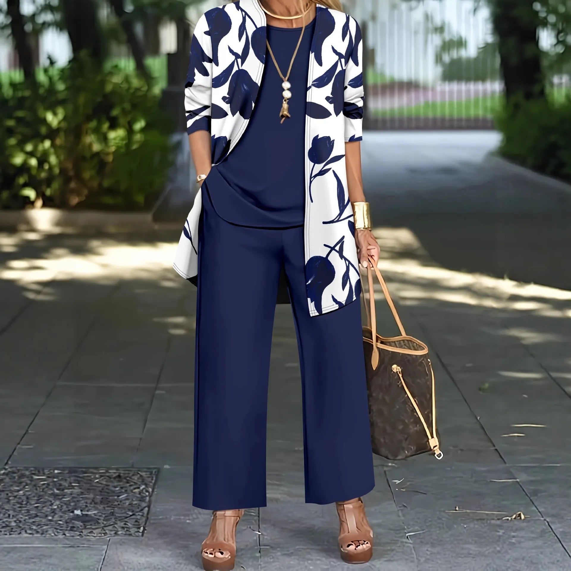 Women's three-piece casual suit in blue with coat, vest, and trousers, featuring printing details and long sleeves