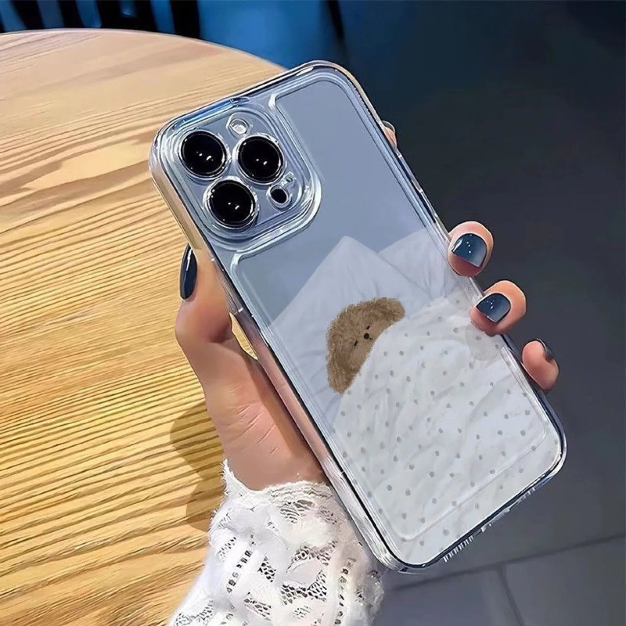 Transparent Apple iPhone case with sleeping cat pattern showing phone protection features