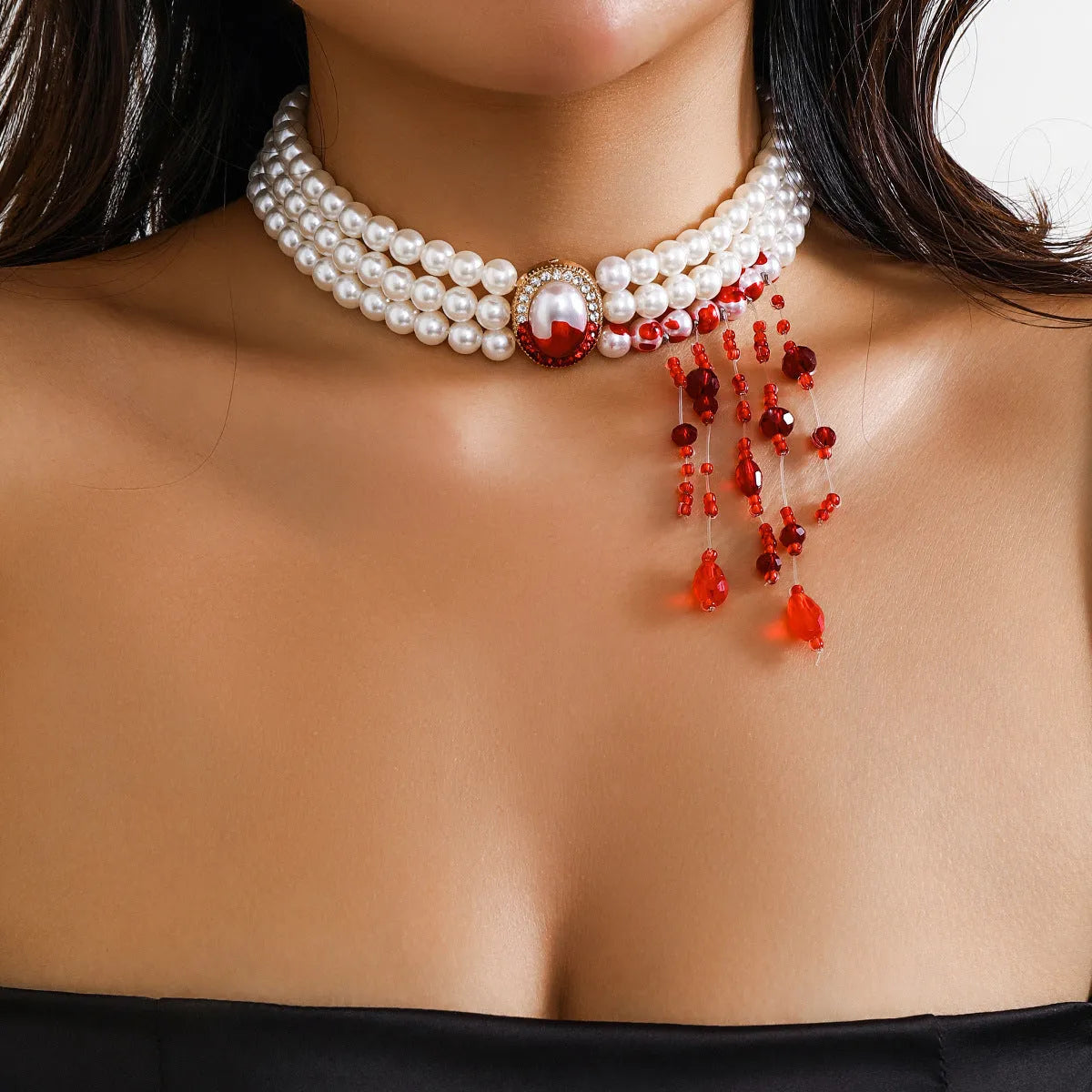 Halloween pearl collar jewellery set with gold-toned necklace, bracelet, and ear studs in retro gothic style