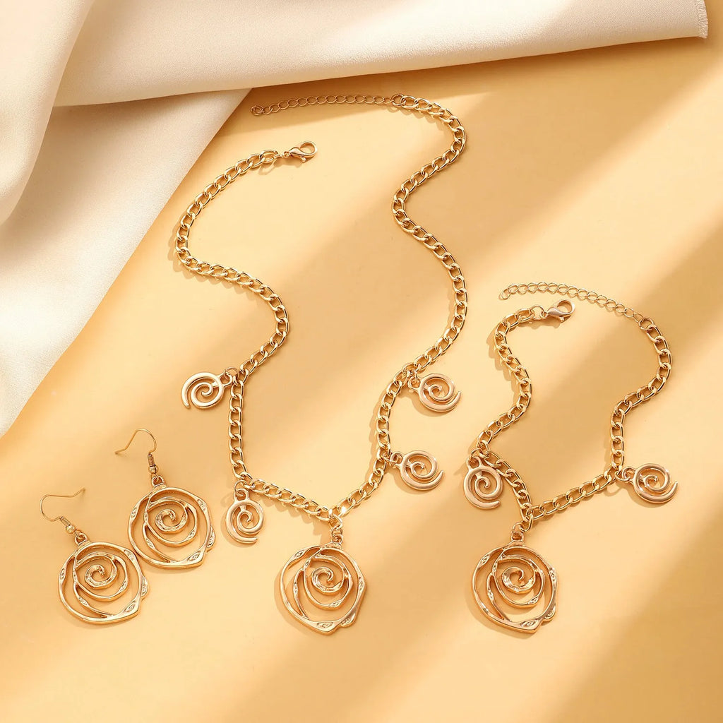 Spiral donut jewellery set with necklace, bracelet, and earrings in gold electroplated alloy