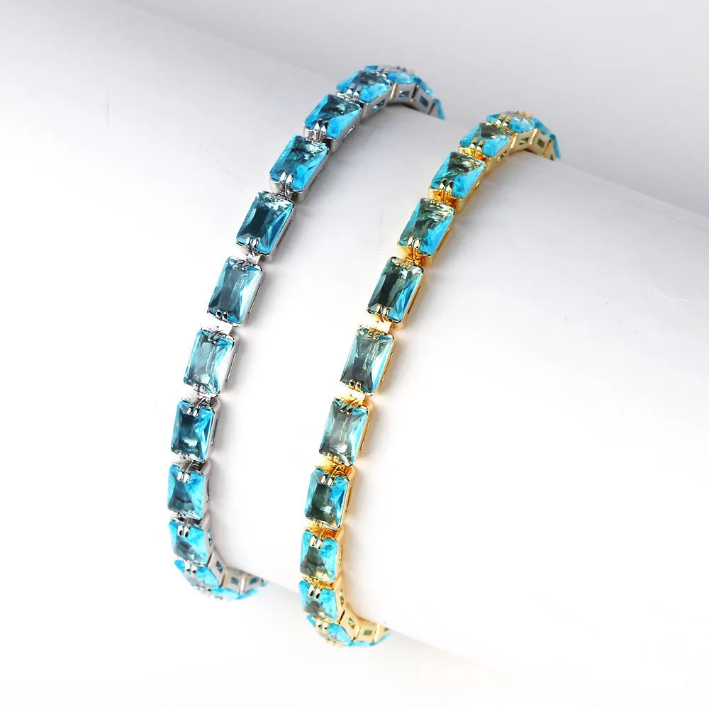 Electroplated zircon bracelet for women with gold tone finish and blue zircon stones