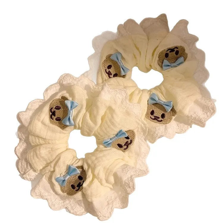 Blue cloth hair ring with bear motif and bowknot design on elastic band