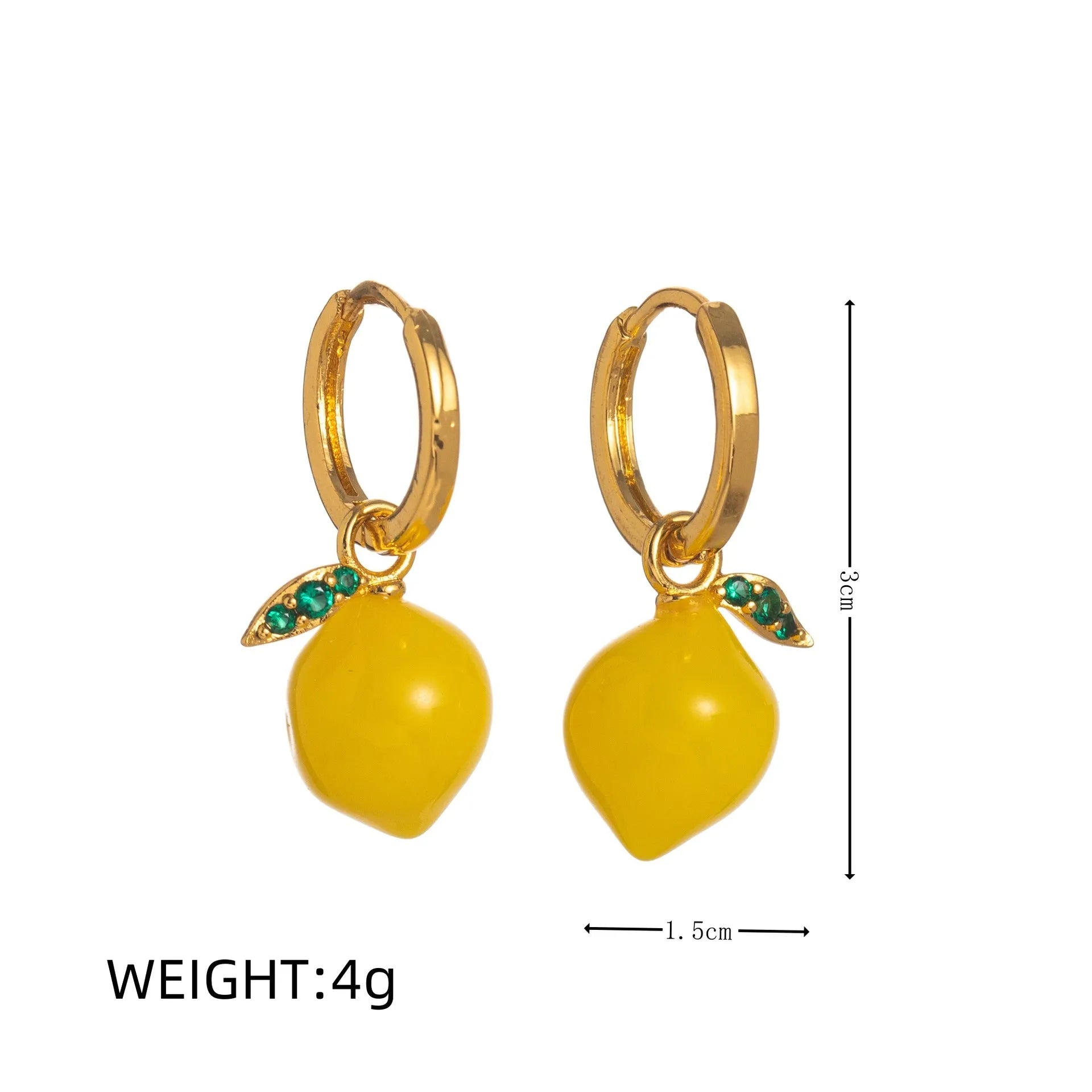 Gold plated copper earrings shaped like carrots, lemons, blueberries, olives, oranges, peaches, and chillies.