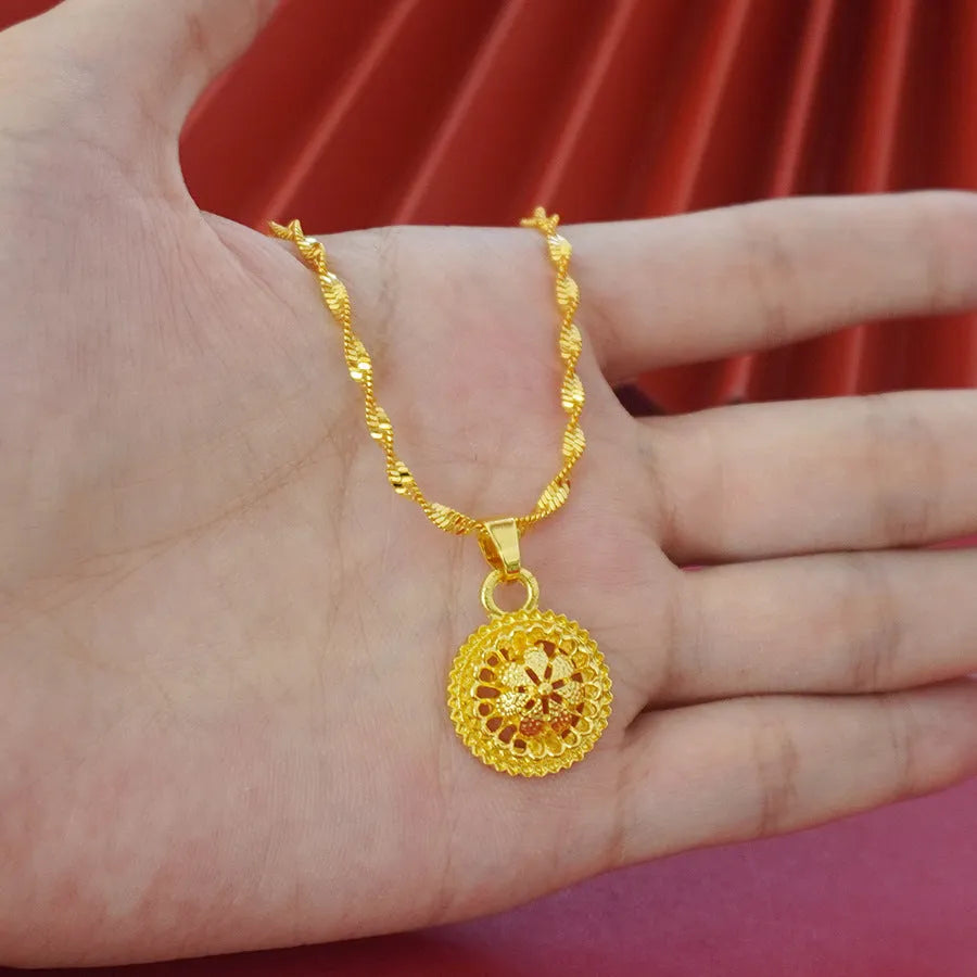 Gold-plated three-piece jewellery set with floral design, showing necklace, earrings, and ring with electroplated finish