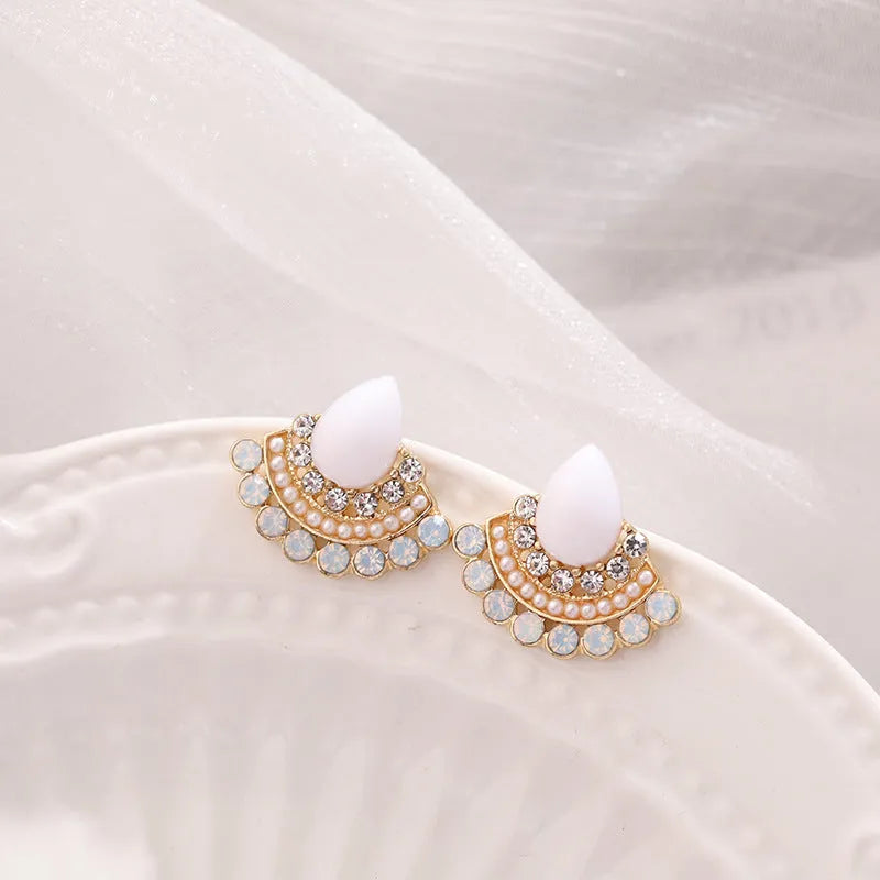 Women's silver geometric fan-shaped earrings with rhinestone and opal detailing on alloy base