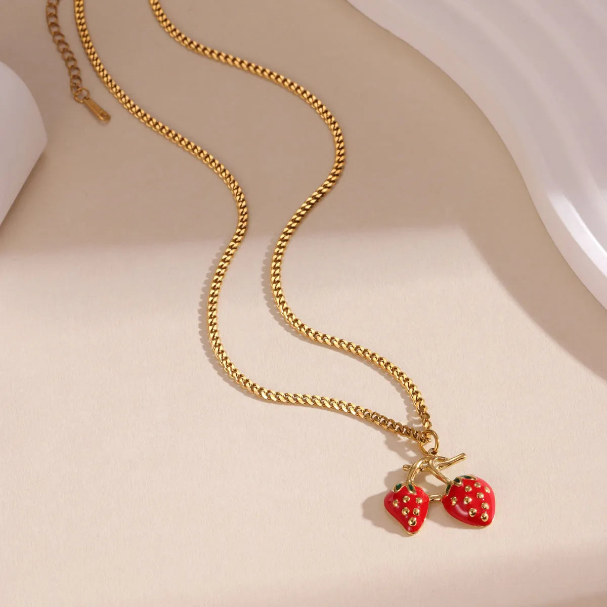 Stainless steel strawberry pendant necklace with 3cm charm in red or white powder gradient finish