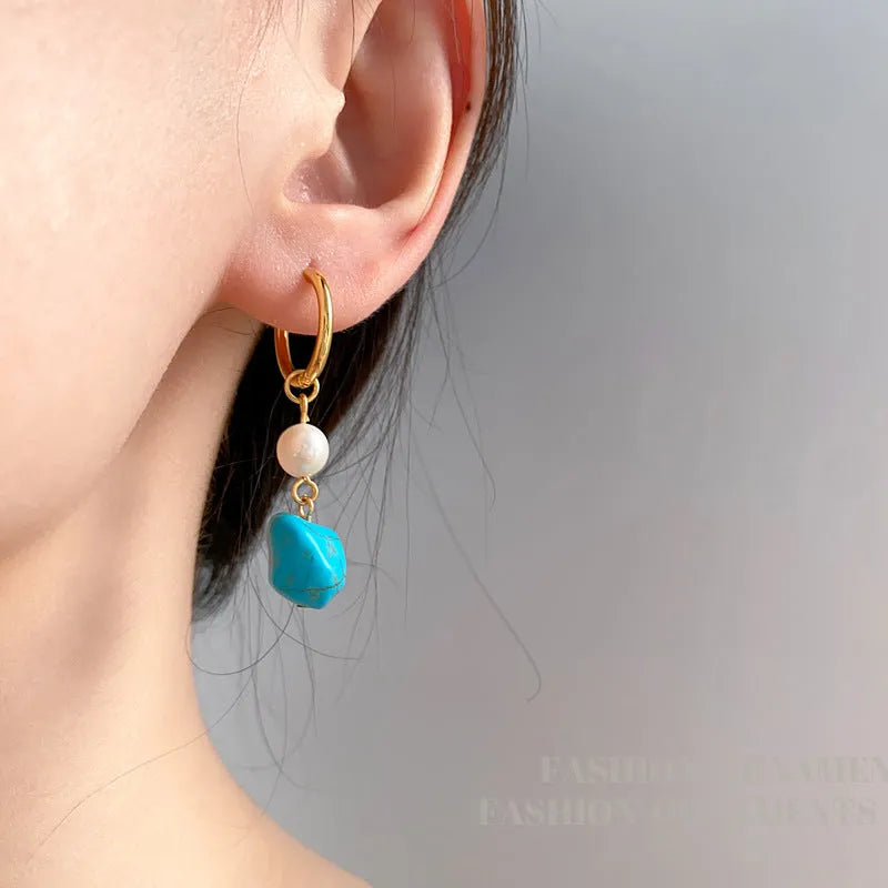 Irregular turquoise ear clips with cultured pearls on copper geometry frame, showing both short and dangle earring options