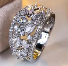Women's round hollow fashion ring in copper with gold or platinum plating options