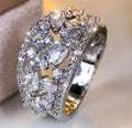 Women's round hollow fashion ring in copper with gold or platinum plating options