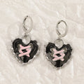 Women's alloy earrings with dripping oil treatment in five colour options showing cross and heart designs