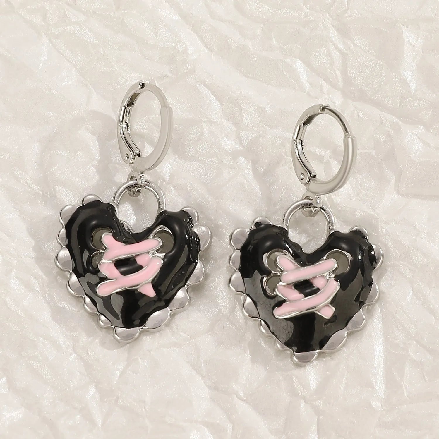 Women's alloy earrings with dripping oil treatment in five colour options showing cross and heart designs