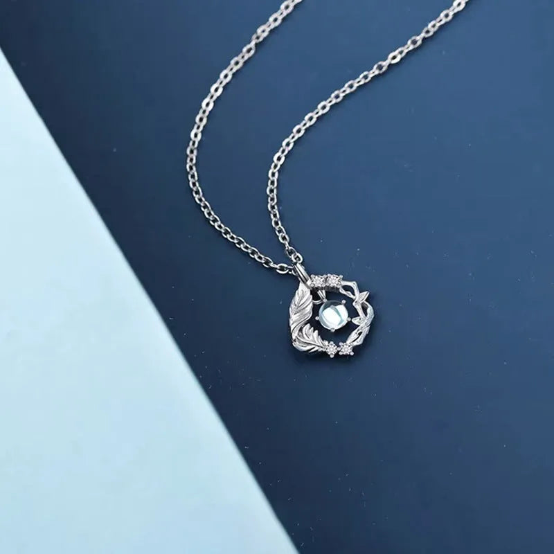 Women's adjustable tree and bird pendant necklace with geometric alloy design in blue eucalyptus colour