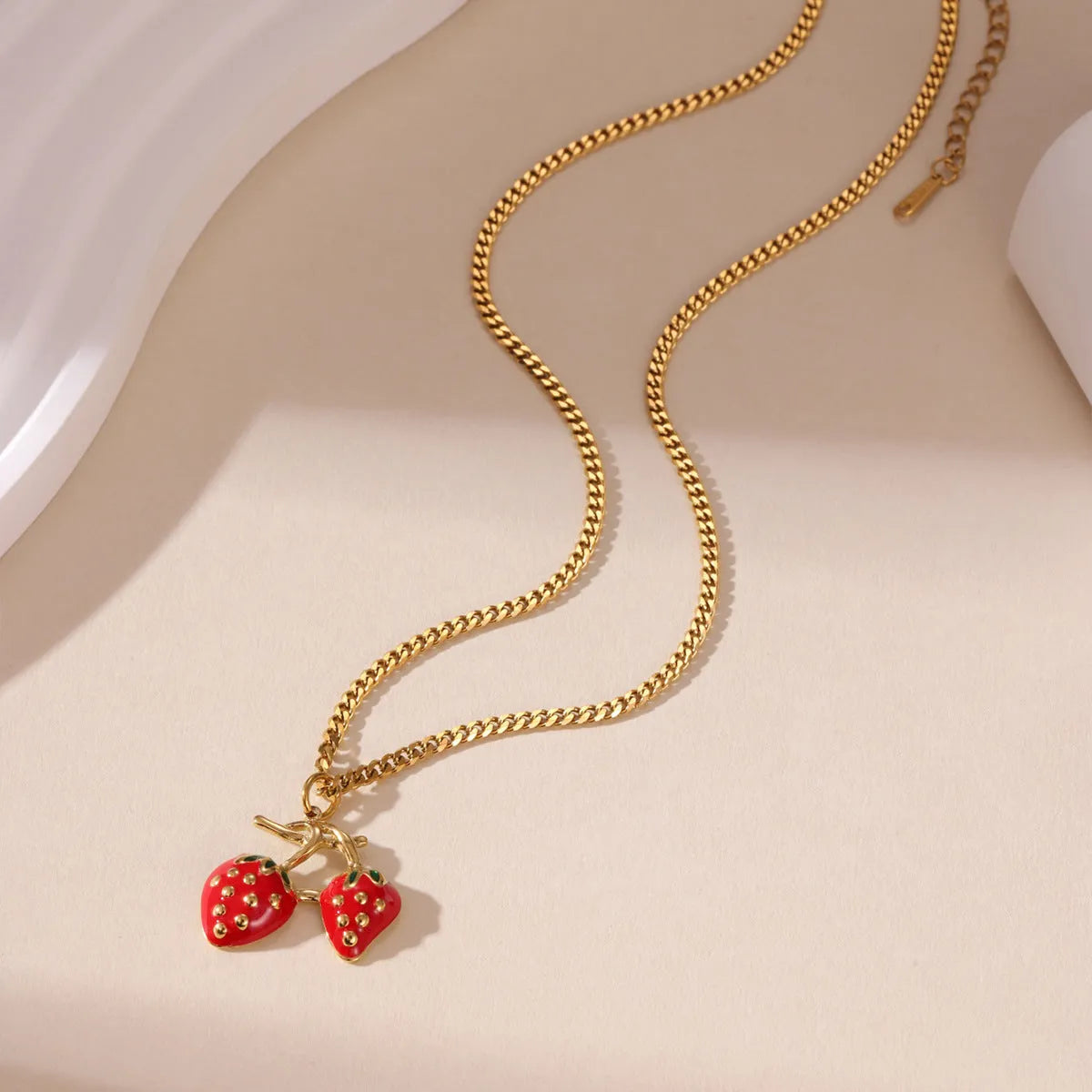 Stainless steel strawberry pendant necklace with 3cm charm in red or white powder gradient finish