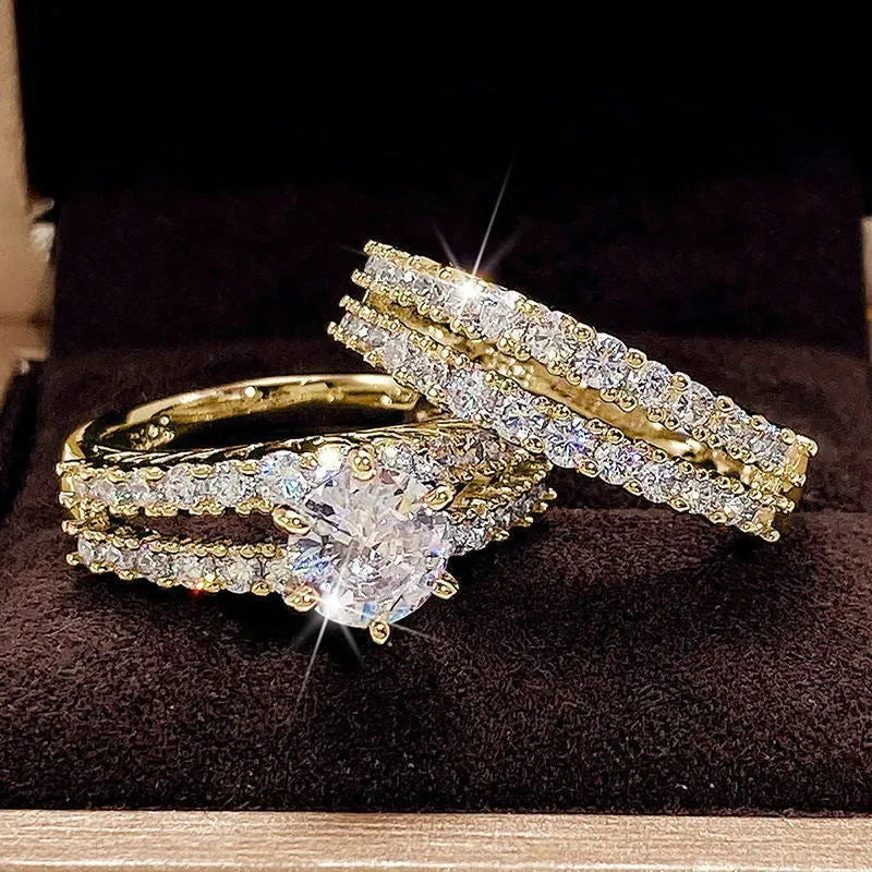 A 2 in 1 female ring set showing a geometric fashion ring and a fully-jewelled ring in gold, rose gold, or silver colour on a UK size 8 finger.