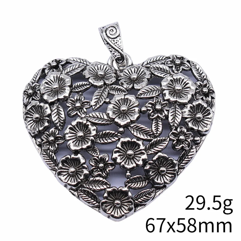 Ancient silver hollow flower alloy pendant measuring 67mm by 58mm