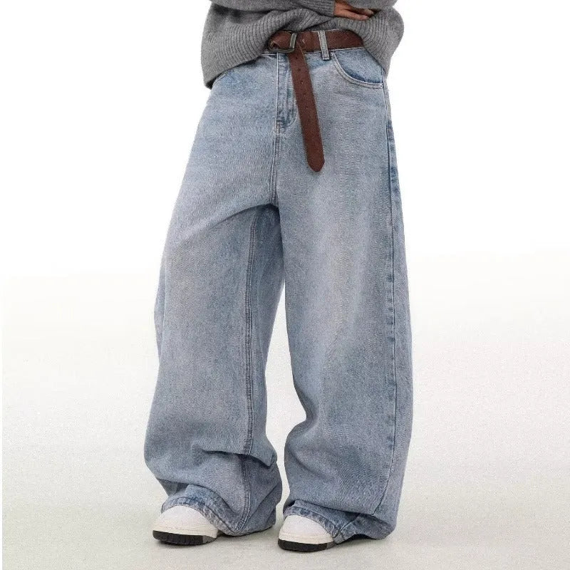 Men's blue straight leg jeans with a distressed retro wash and a mid-rise waist.