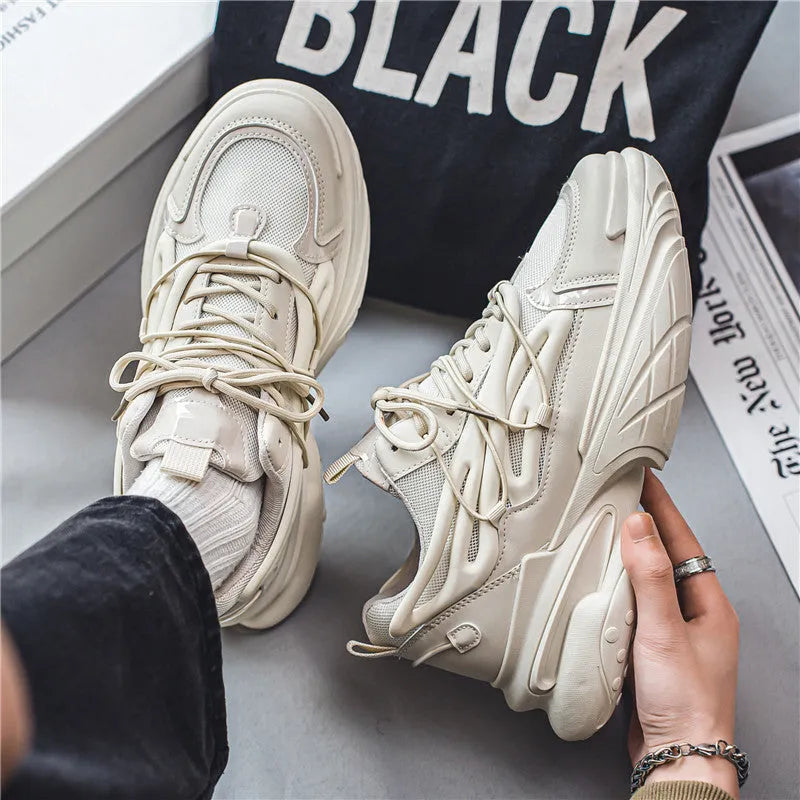 Men's low-top sneakers in beige with mesh and PU leather upper and rubber sole on a plain background