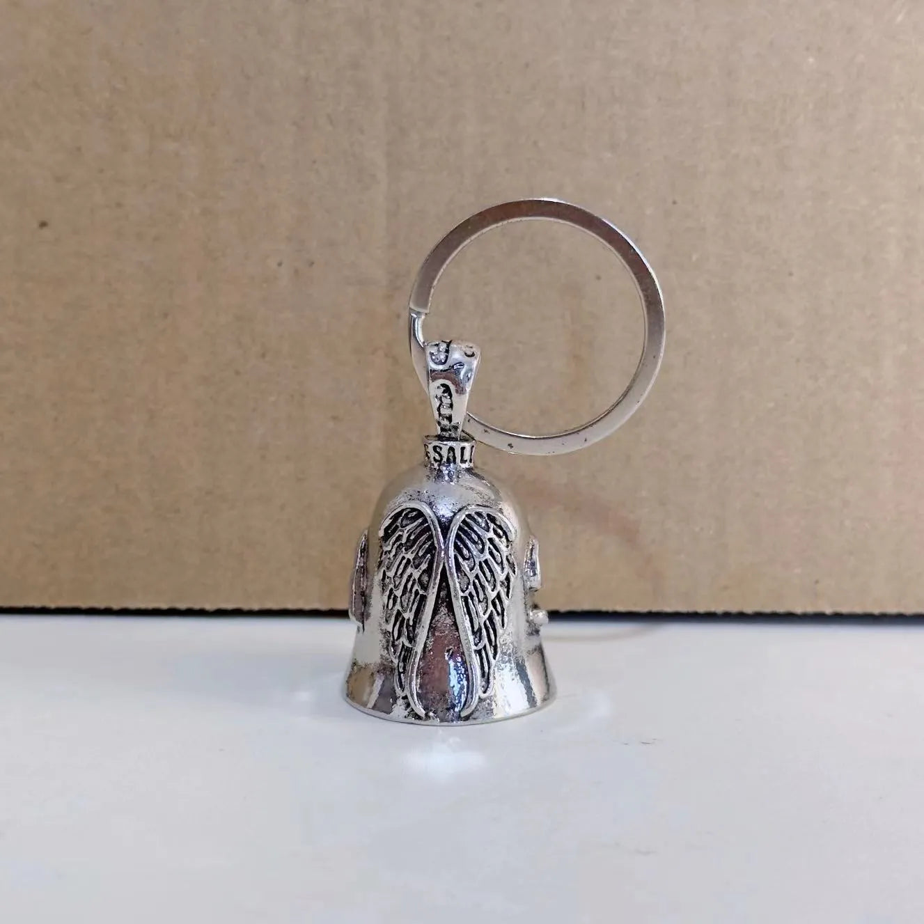 Vintage angel feather keychain and necklace set with electroplated alloy construction showing feather design detail
