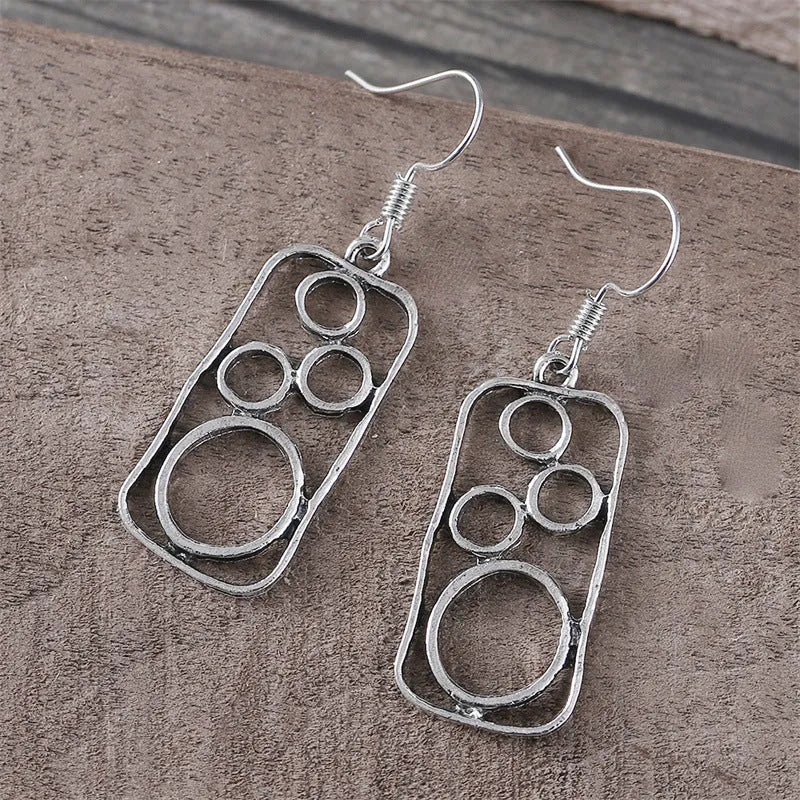 Pair of antique silver geometric earrings with an irregular square stud and round ring on zinc alloy posts.