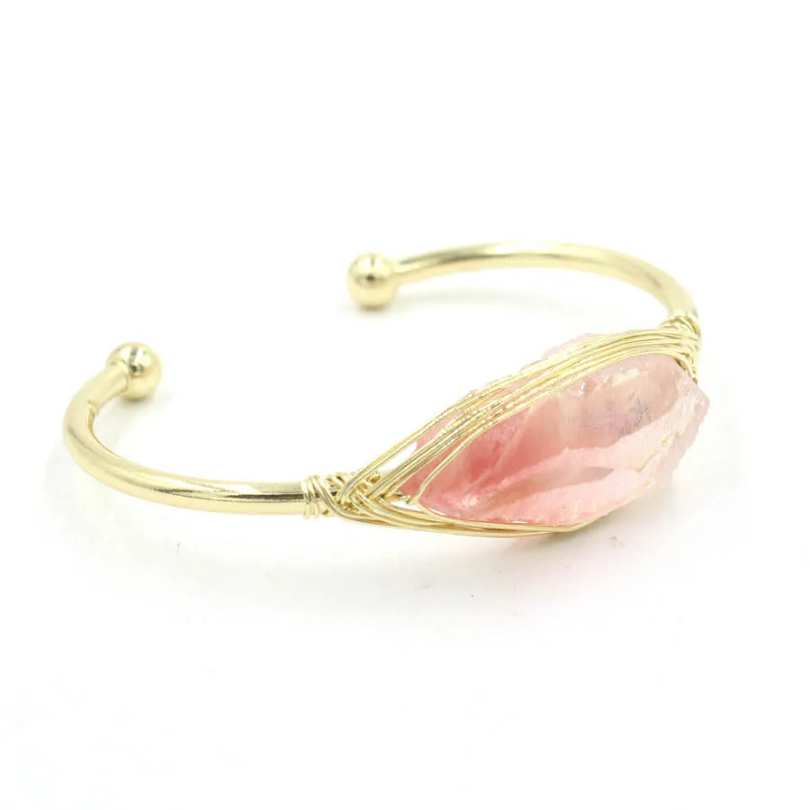 Natural raw gemstone bracelet with 8mm amorphous crystals in various colours on a wrist, showing ethnic style and simple clasp.