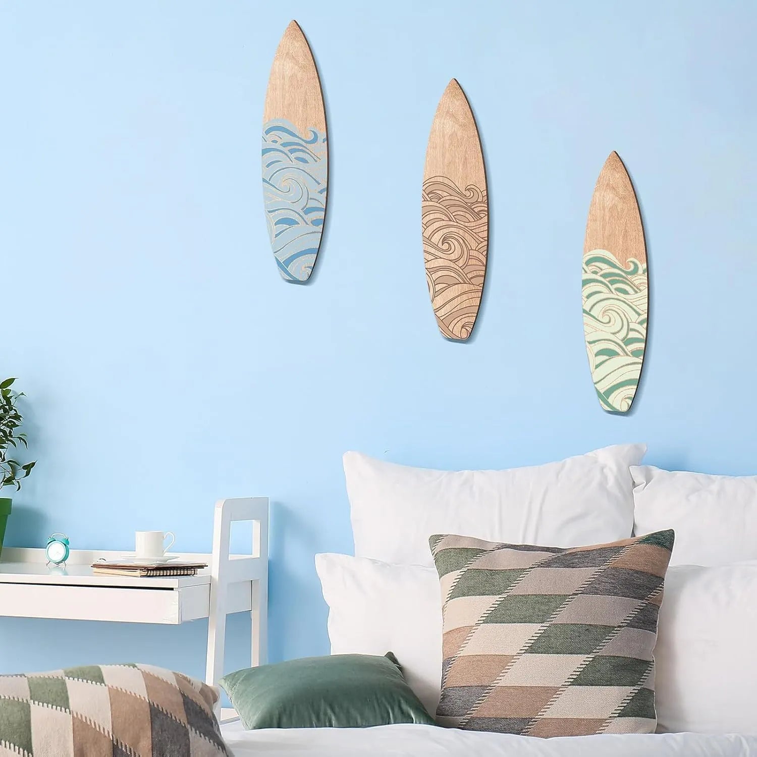 Three wooden surfboard wall decorations made from boxwood, each measuring 8.5cm wide by 30cm long